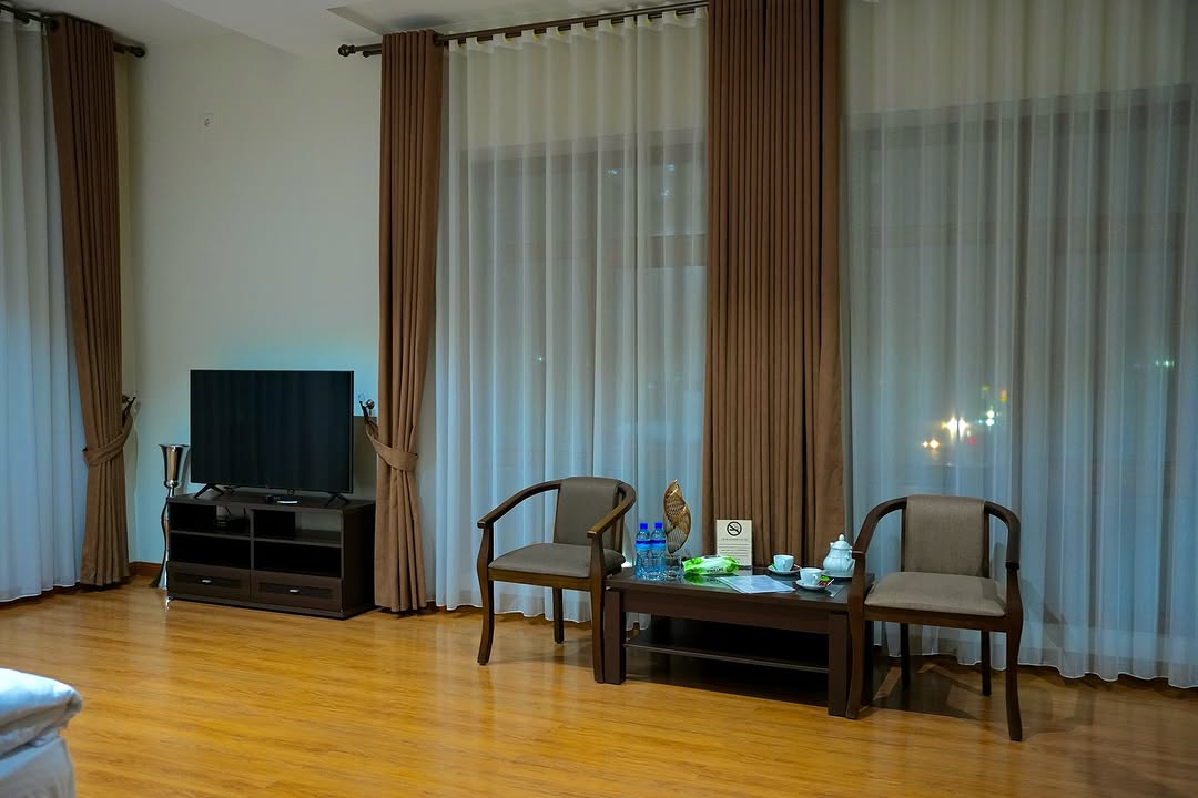 Room with TV area — BOSHIDAN Hotel